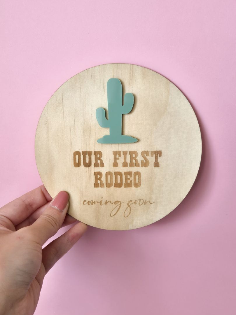 AXN Laser Creations Pregnancy Reveal and Announcement Plywood Plaque - Our First Rodeo